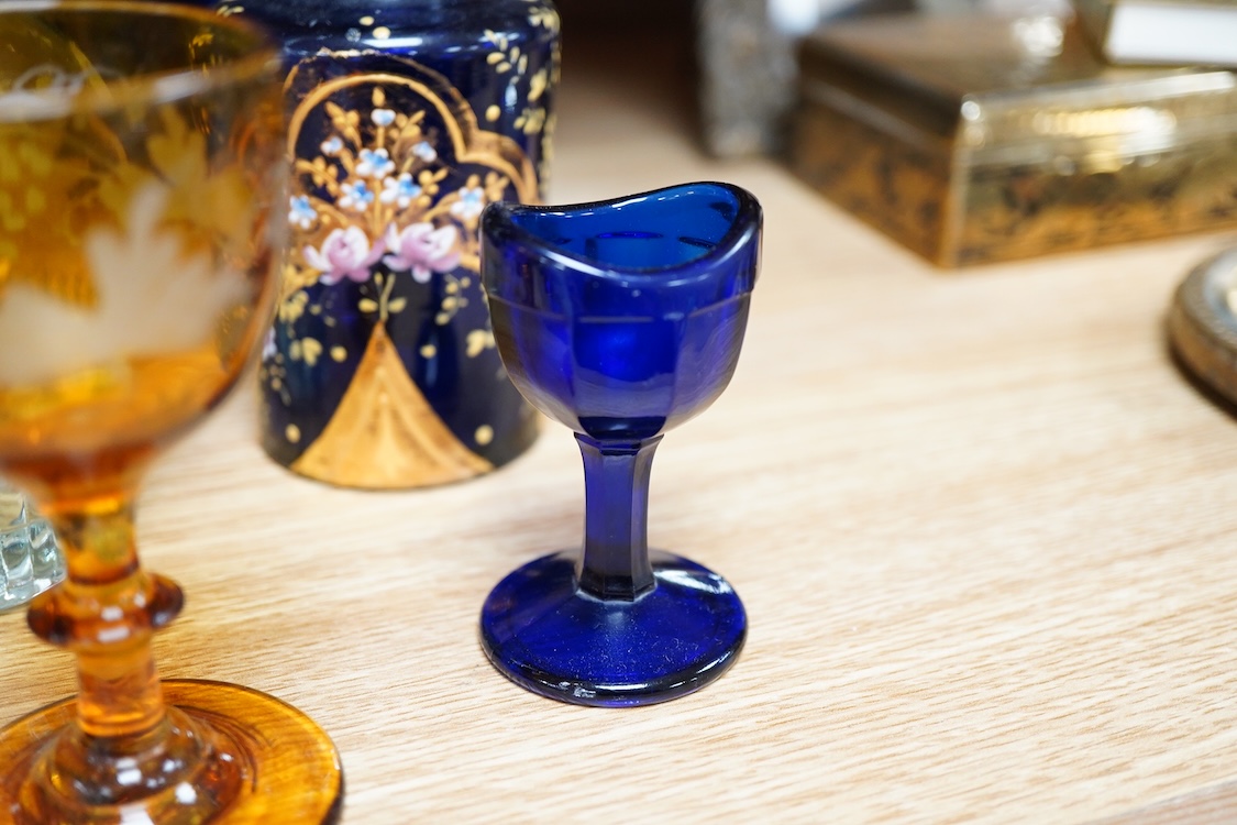 A collection of coloured glass flagons, glasses and bottles etc. (18). Tallest decanter and stopper 25cm high.